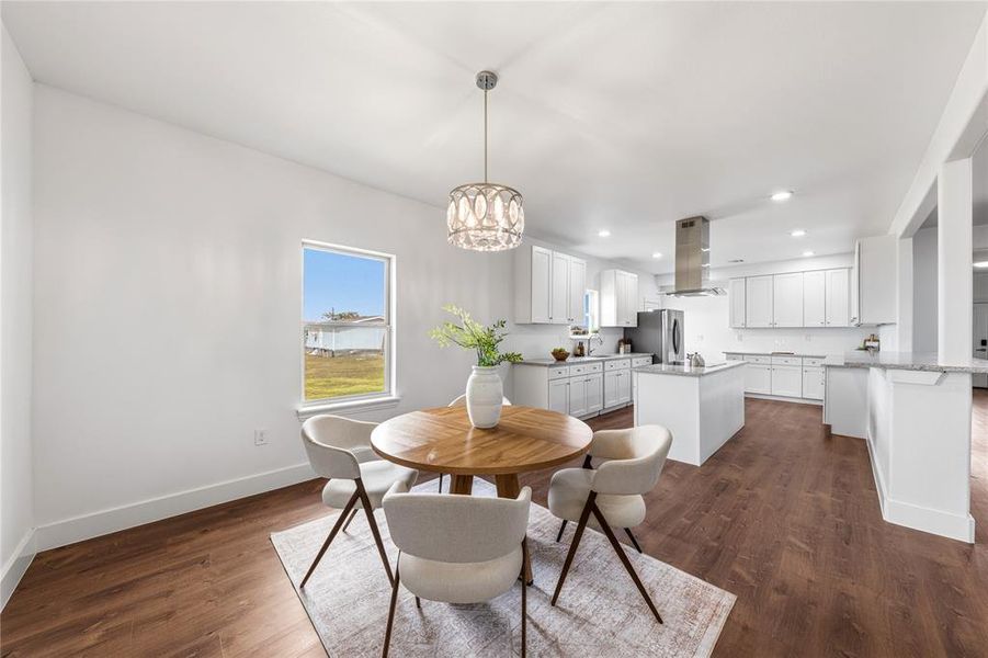 Open-concept living space featuring a modern kitchen and dining area
