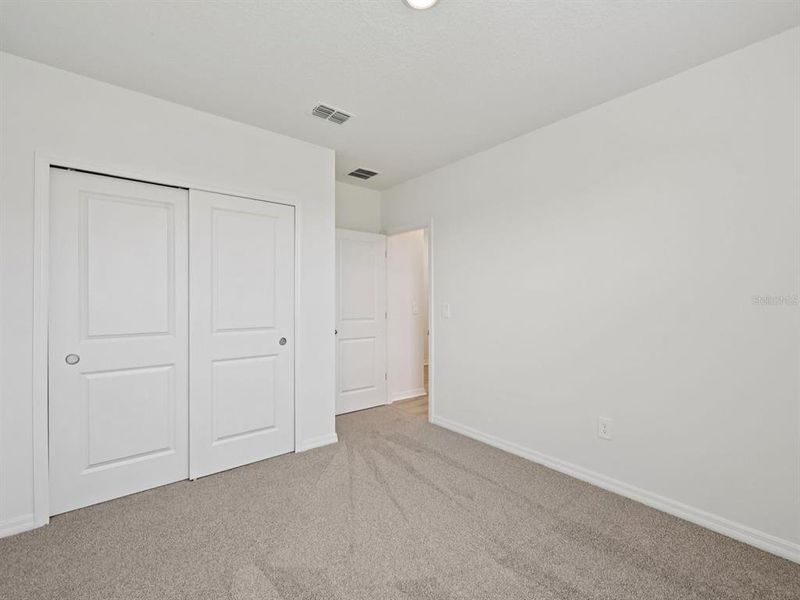 Spacious, unfurnished interior of a new home in The Reserve at Van Oaks, Auburndale (Image 27).