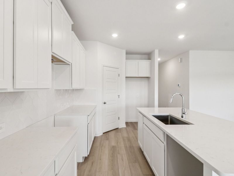 Kitchen in the Callaghan floorplan at a Meritage Homes community. Kitchen in the Callaghan floorplan at a Meritage Homes community.