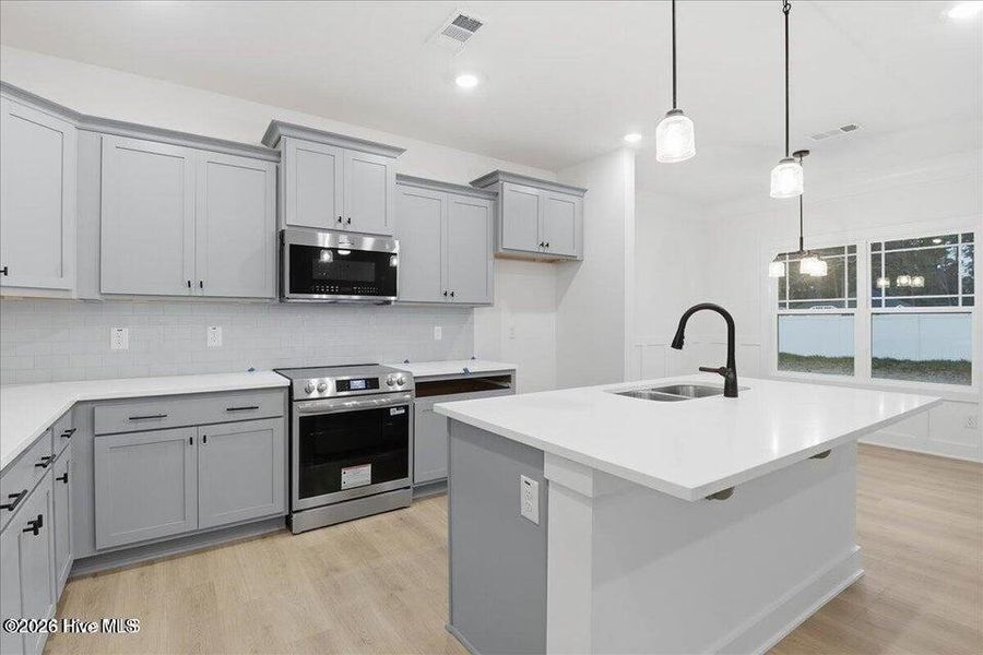 Furnished interior view inside a new home in Wood Creek Landing, Leland (Image 6).