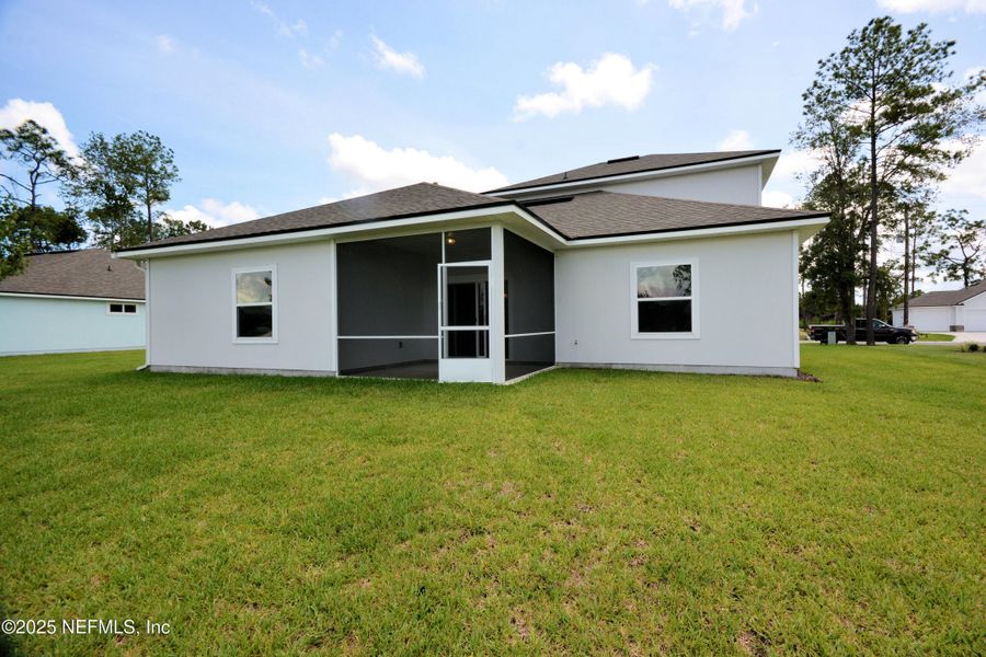 Front exterior of a new home in , Jacksonville, FL, highlighting curb appeal (Image 2).