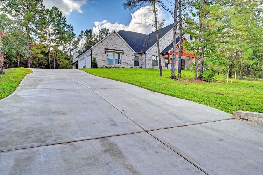 Front exterior of a new home in , Montgomery, TX, highlighting curb appeal (Image 2).
