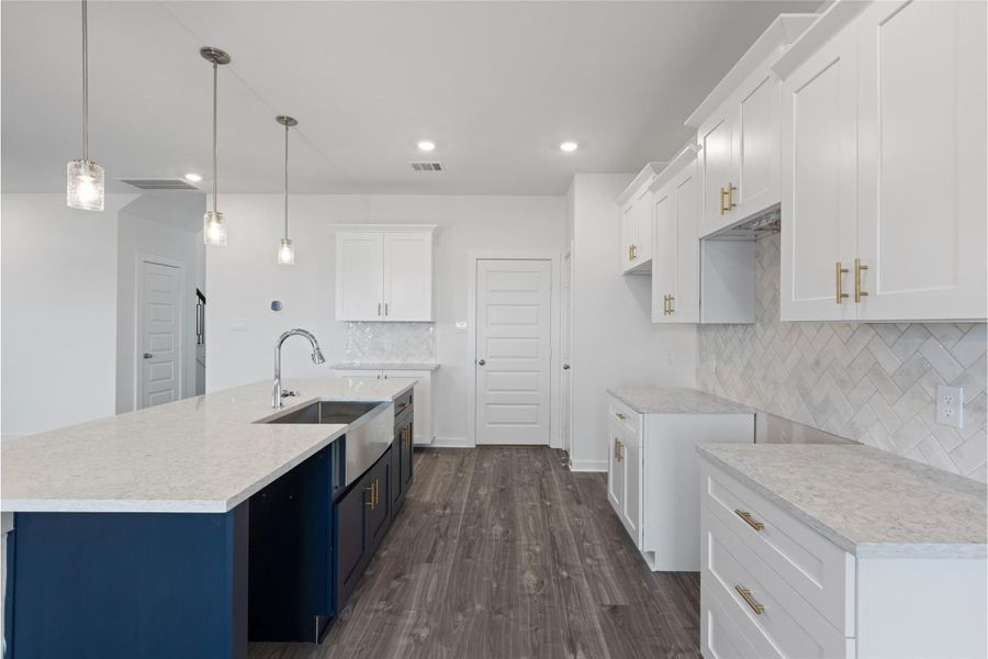 Stunning Quartz countertops with Blue veins running through.