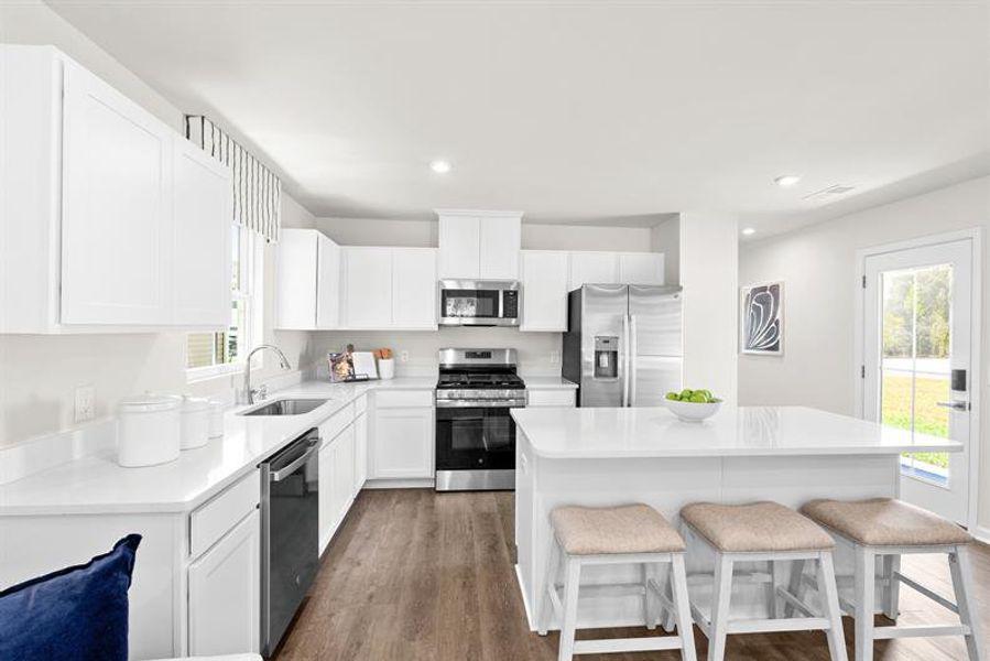 Representative furnished interior of a home built from the Ellis by Ryan Homes in Middle Creek Village Coastal Cottages & Villas, Bolivia (Image 5).