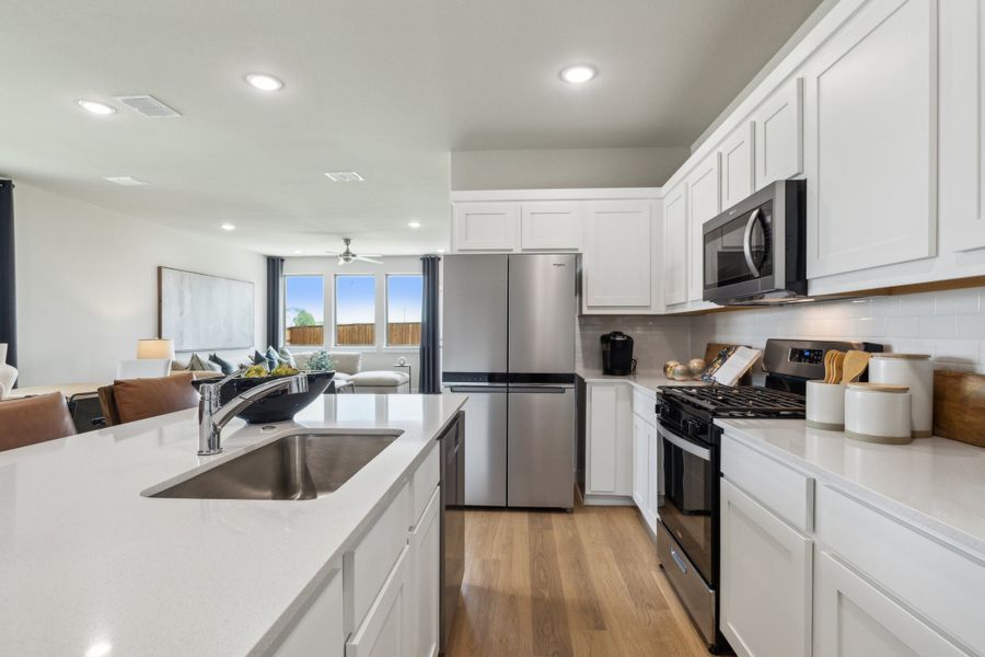 Kitchen in the Willow home plan by Trophy Signature Homes – REPRESENTATIVE PHOTO