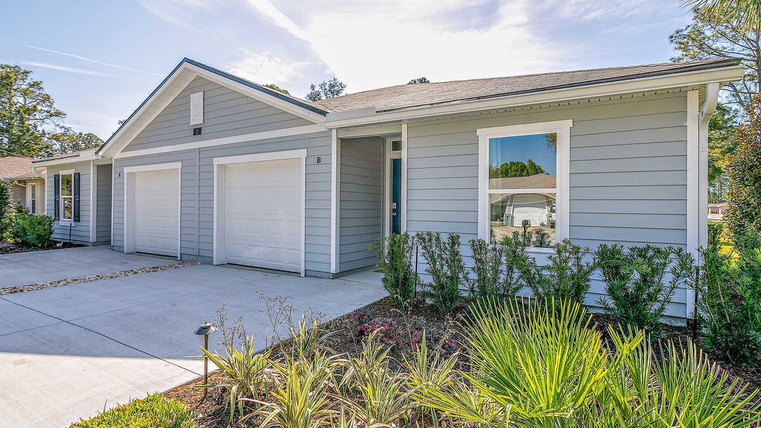 Representative exterior photo of a completed home built from the Surfside by D.R. Horton in Palm Coast Villas, Palm Coast, FL (Image 2).