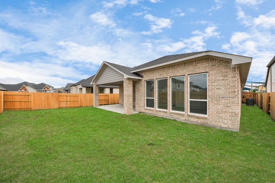 Front exterior of a new home in 50' Traditional Homes at Elyson, Katy, TX, highlighting curb appeal (Image 25). Front exterior of a new home in 50' Traditional Homes at Elyson, Katy, TX, highlighting curb appeal (Image 25).