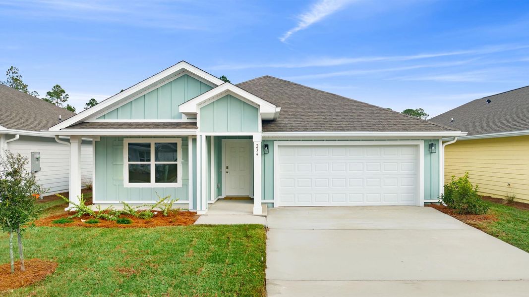 Front exterior of a new home in Ashton Park Phase III, Freeport, FL, highlighting curb appeal (Image 1).