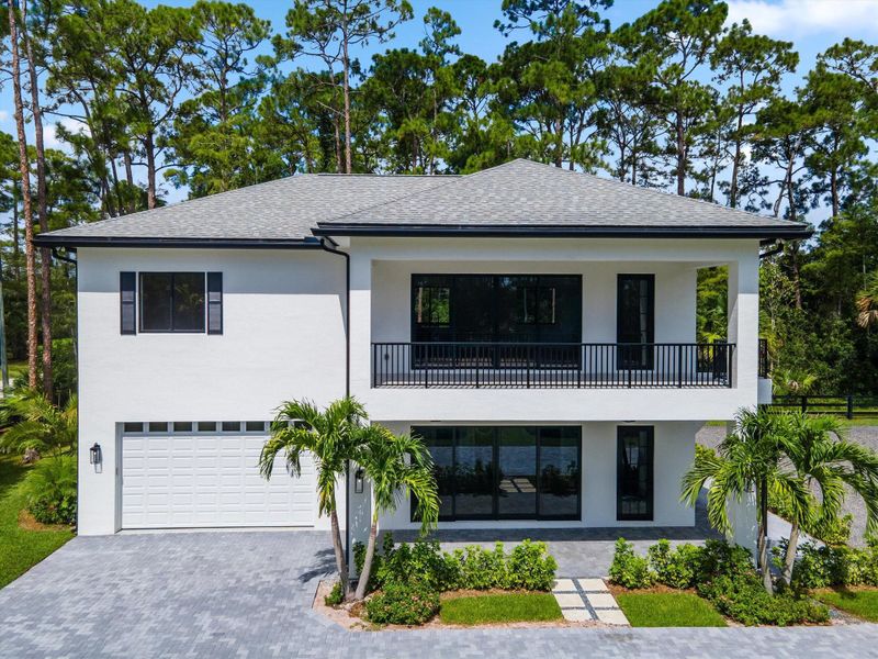 Front exterior of a new home in , Wellington, FL, highlighting curb appeal (Image 34).