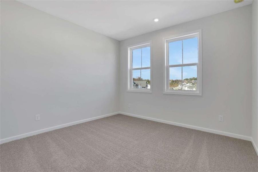 Spacious, unfurnished interior of a new home in The Paddocks at Doc Hughes, Buford (Image 33).