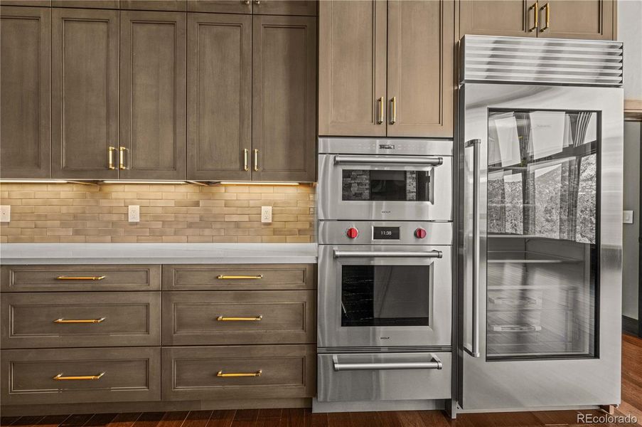 Maplewood cabinets with cherrywood inserts, ample storage and Wolf and Subzero appliances Maplewood cabinets with cherrywood inserts, ample storage and Wolf and Subzero appliances