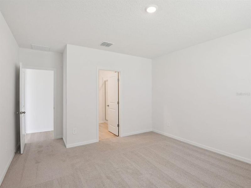 Spacious, unfurnished interior of a new home in The Grove at Stuart Crossing - Classic Series, Bartow (Image 18).