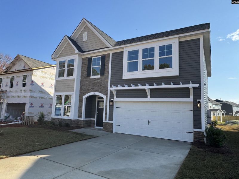 Front exterior of a new home in Boykin Hills, Chapin, SC, highlighting curb appeal (Image 1). Front exterior of a new home in Boykin Hills, Chapin, SC, highlighting curb appeal (Image 1).