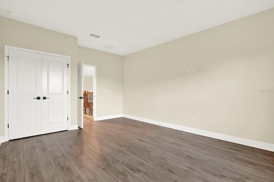 Spacious, unfurnished interior of a new home in The Towns At Long Bayou, Seminole (Image 26).
