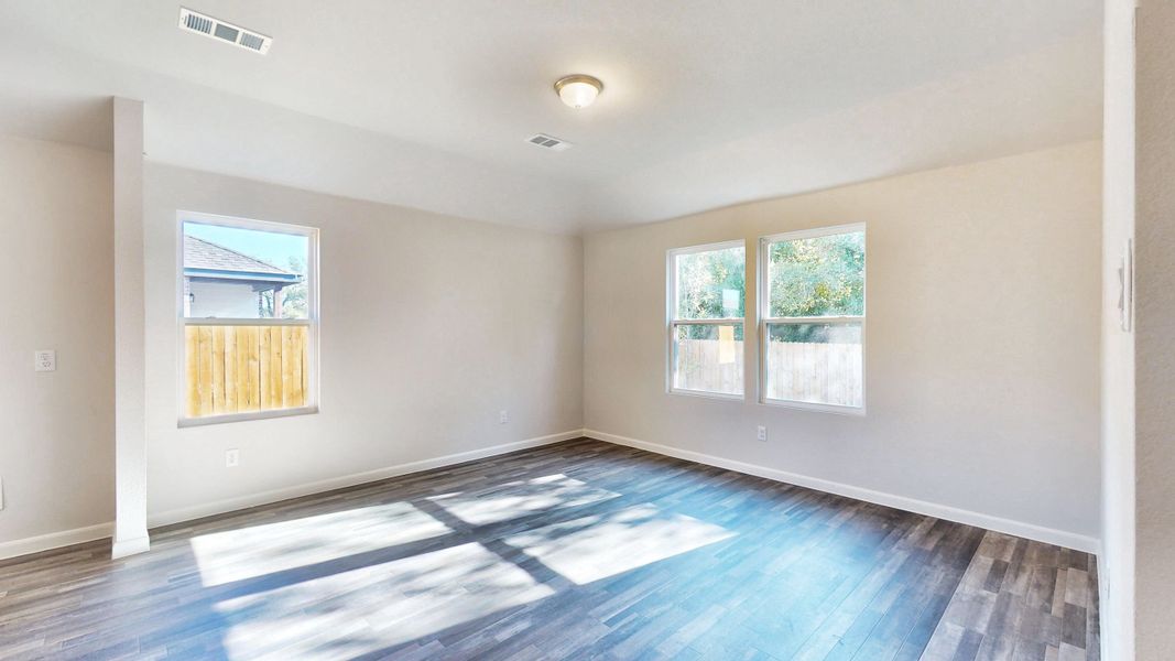 A room with a blue floor and windows. A room with a blue floor and windows.