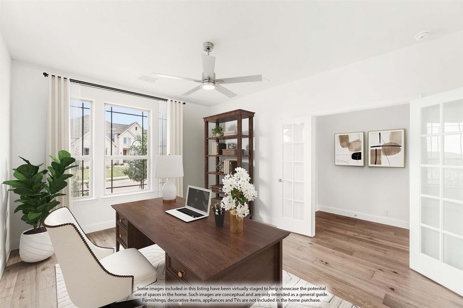 Home office with wood desk, ceiling fan, hardwood floors, and French doors