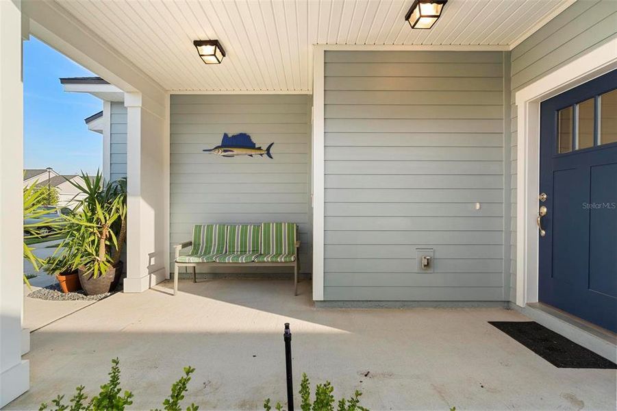 Front porch with space for relaxing taking in the pristene neighbothood.