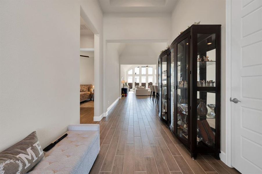 8' Wide entryway welcomes you in. From these wood look tile floors to these 13' ceilings you instantly feel the grandeur this home offers.