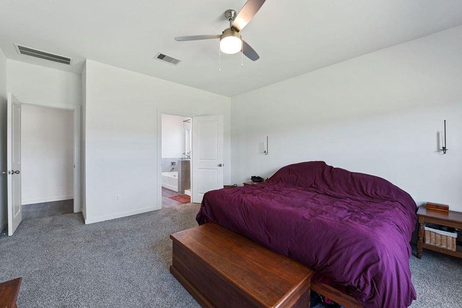 The primary bedroom has a private en suite bathroom