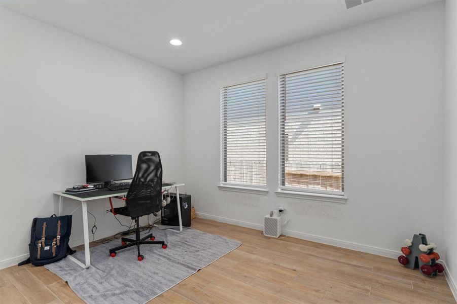 Office featuring light wood-style floors and recessed lighting
