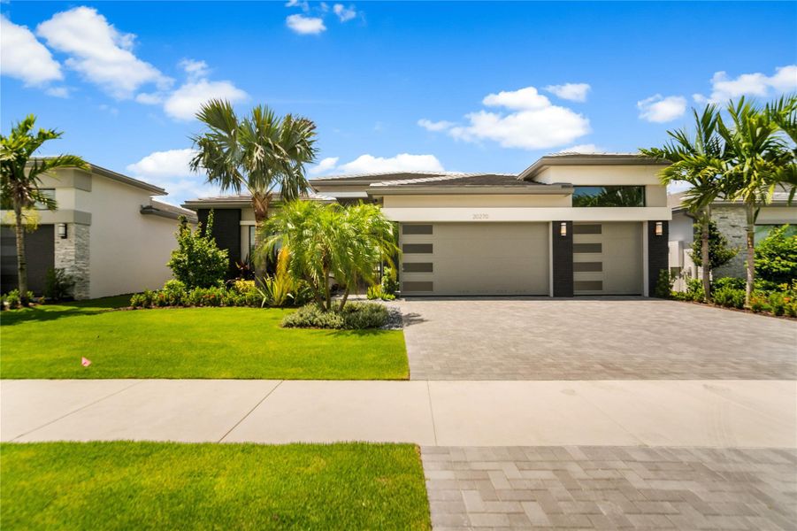 Front exterior of a new home in , Boca Raton, FL, highlighting curb appeal (Image 24). Front exterior of a new home in , Boca Raton, FL, highlighting curb appeal (Image 24).