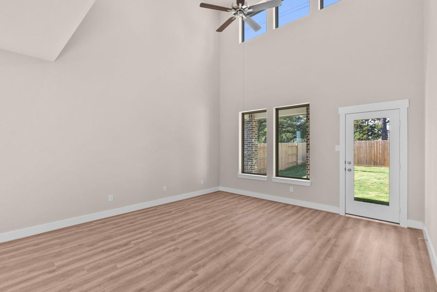 Imagine walking into a home that feels as expansive as it is inviting, bathed in natural light and framed by soaring ceilings that make every moment feel grand.