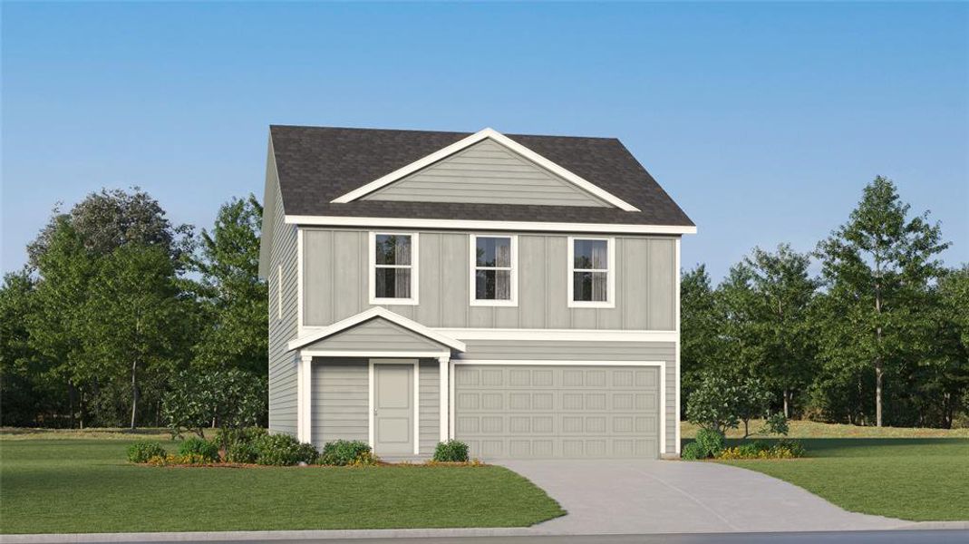 View of front of property with a garage and a front lawn