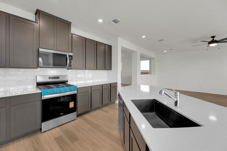 Furnished interior view inside a new home in Salerno - Classic Collection, Round Rock (Image 10). Furnished interior view inside a new home in Salerno - Classic Collection, Round Rock (Image 10).