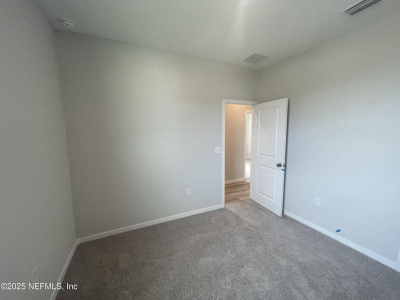 Spacious, unfurnished interior of a new home in Palm Series at Seminole Palms, Palm Coast (Image 17).