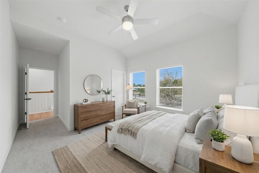 Primary bedroom with private treetop views.