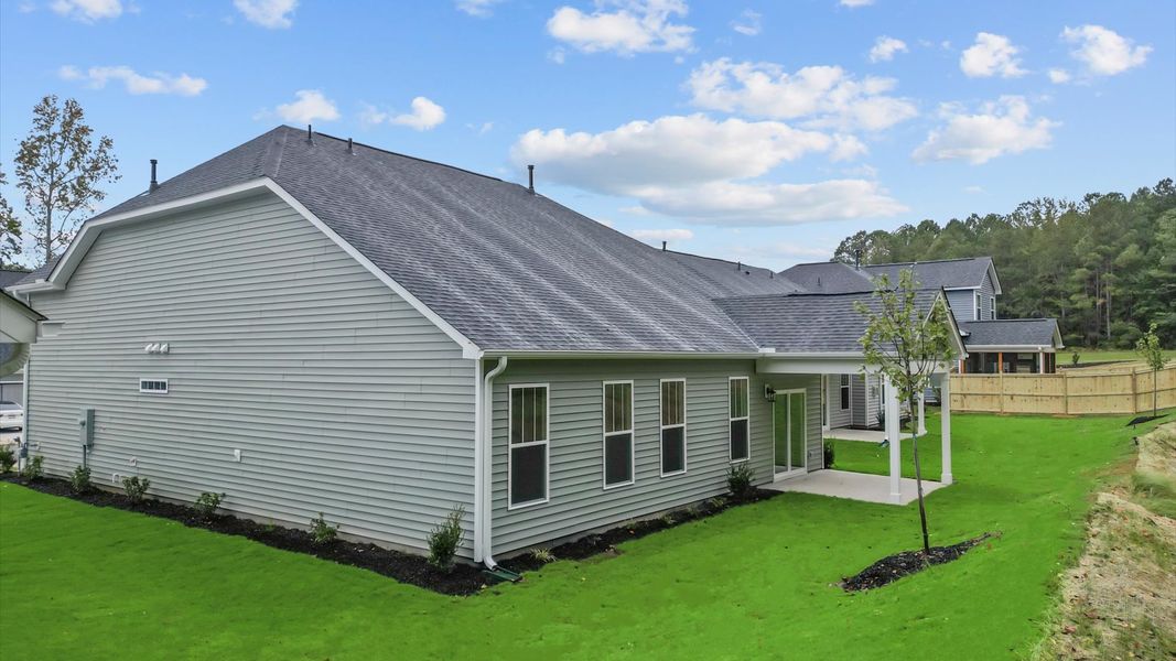 Elegant exterior with a rear covered porch—perfect for relaxing or entertaining outdoors