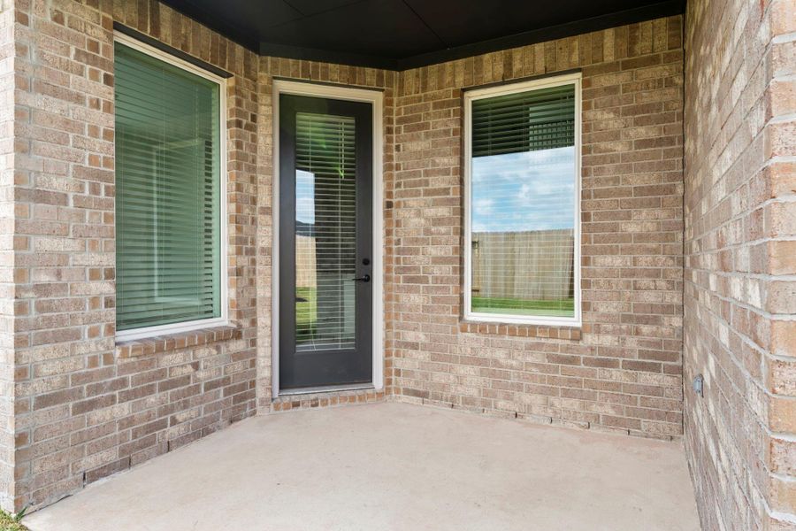 Exterior details and patio area of a home in Westland Ranch 50' Homesites, League City (Image 26).