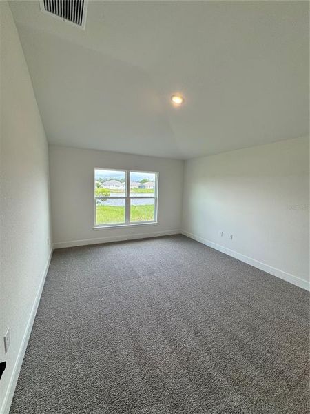Spacious, unfurnished interior of a new home in Watercress Cove, North Port (Image 11).