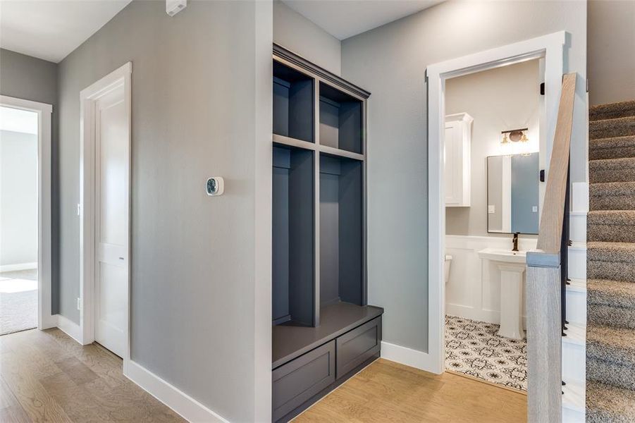 Mudroom featuring light wood-style flooring and baseboards Mudroom featuring light wood-style flooring and baseboards