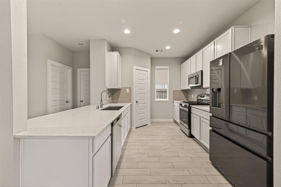 It is equipped with stainless steel appliances, combining style and functionality for everyday cooking.