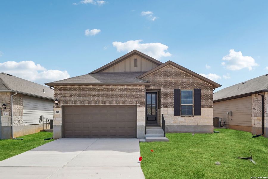 Front exterior of a new home in Legendary Trails - Premier Series, Cibolo, TX, highlighting curb appeal (Image 1). Front exterior of a new home in Legendary Trails - Premier Series, Cibolo, TX, highlighting curb appeal (Image 1).