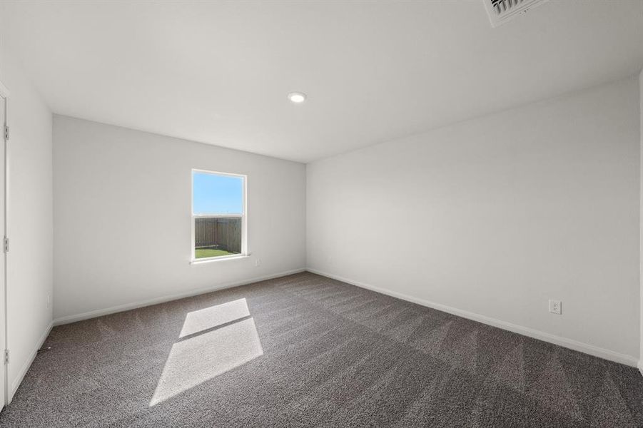 Empty room featuring carpet flooring and recessed lighting Empty room featuring carpet flooring and recessed lighting