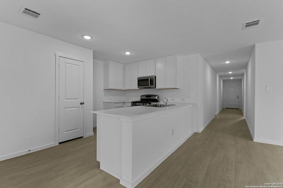 Furnished interior view inside a new home in Voss Farms, New Braunfels (Image 8).
