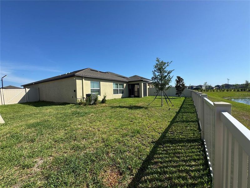 Exterior details and patio area of a home in Prosperity Lakes, Parrish (Image 21).