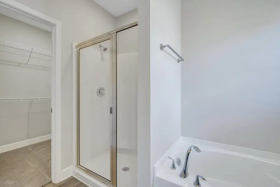 Fripp – Owner’s Bath and Walk-In Closet Fripp – Owner’s Bath and Walk-In Closet