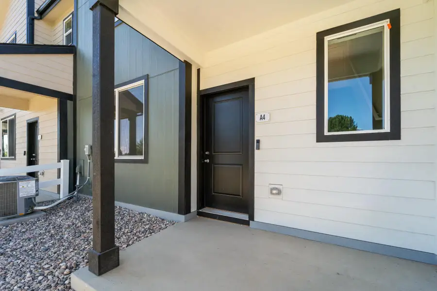 Exterior details and patio area of a home in Conestoga, Ault (Image 3).