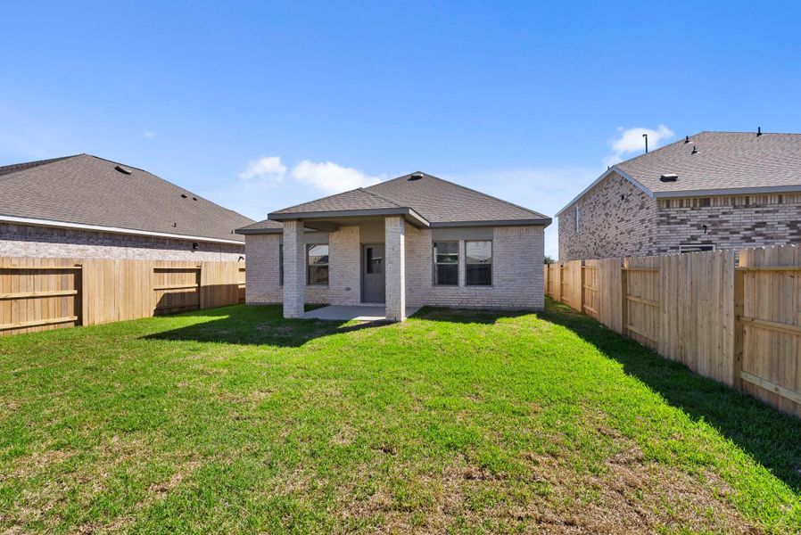 Exterior details and patio area of a home in Windrose Green, Angleton (Image 4).