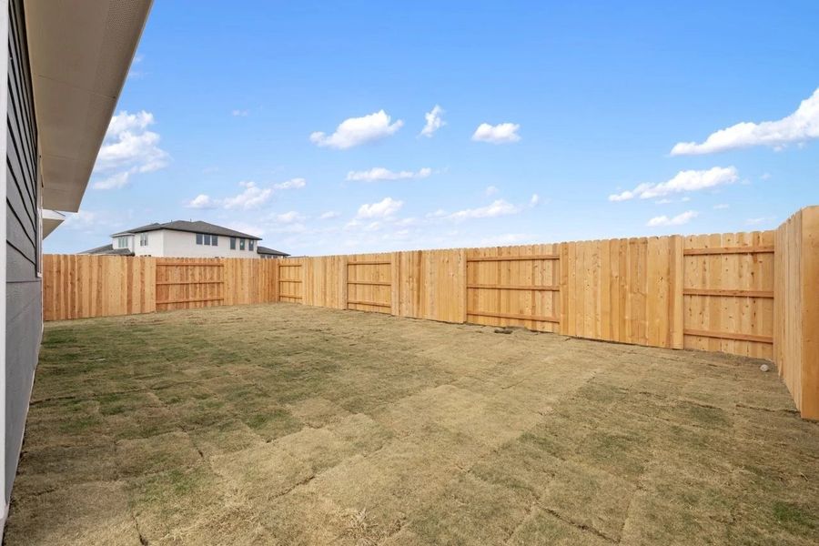 Exterior details and patio area of a home in Lariat, Liberty Hill (Image 28).