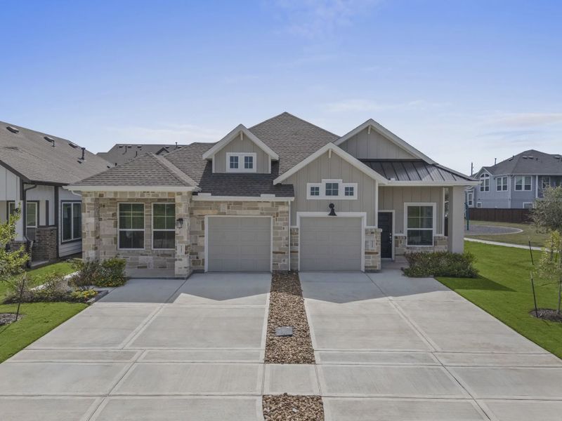 Representative exterior photo of a completed home built from the Carriagehouse by Chesmar Homes in Meridiana Townhomes, Iowa Colony, TX (Image 31).