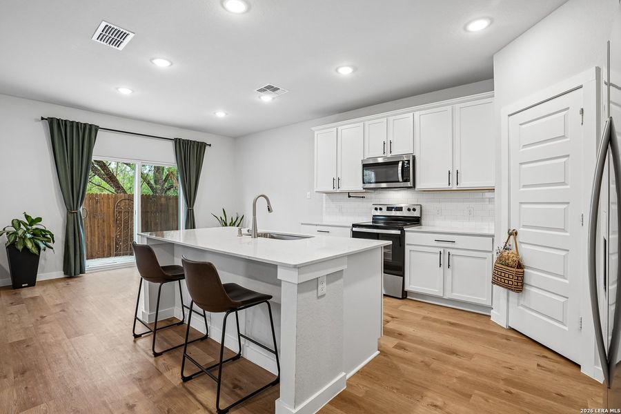 Furnished interior view inside a new home in University Village, San Antonio (Image 14).