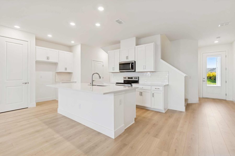Representative furnished interior of a home built from the The Magbee II by David Weekley Homes in North River Ranch – Townhomes, Parrish (Image 5).
