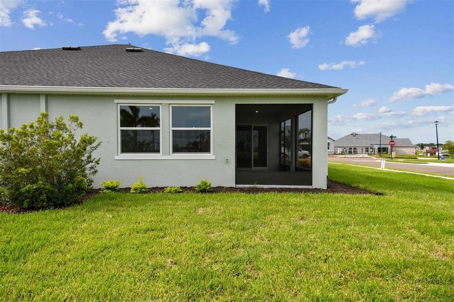 Front exterior of a new home in Gracewater at Sarasota, Sarasota, FL, highlighting curb appeal (Image 2). Front exterior of a new home in Gracewater at Sarasota, Sarasota, FL, highlighting curb appeal (Image 2).
