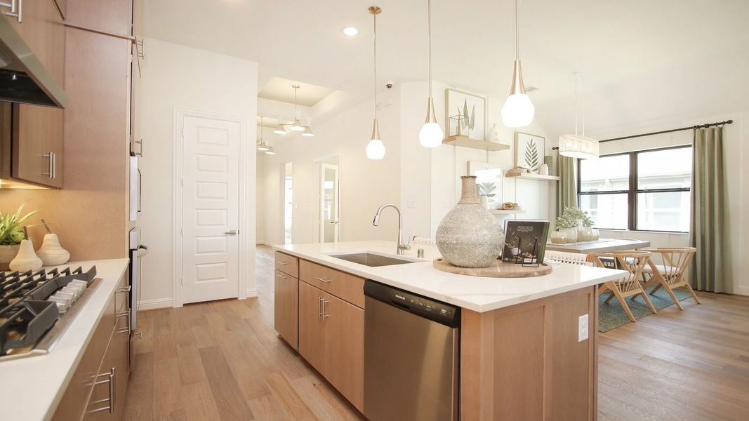Representative furnished interior of a home built from the Juniper by Brightland Homes in Sunterra, Katy (Image 5).