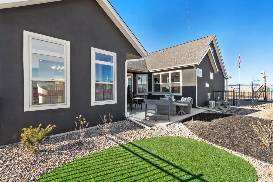 Exterior details and patio area of a home in The Courtyards at Lupton Village, Fort Lupton (Image 4).