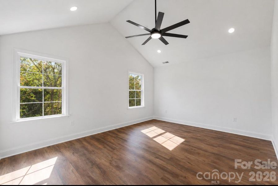 *representative photo- primary bedroom w/ vaulted ceiling
